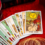 Tarot Cards spread out on a table with a crystal ball